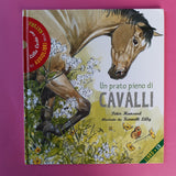 Un prato pieno di cavalli