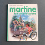 Martine va in bicicletta